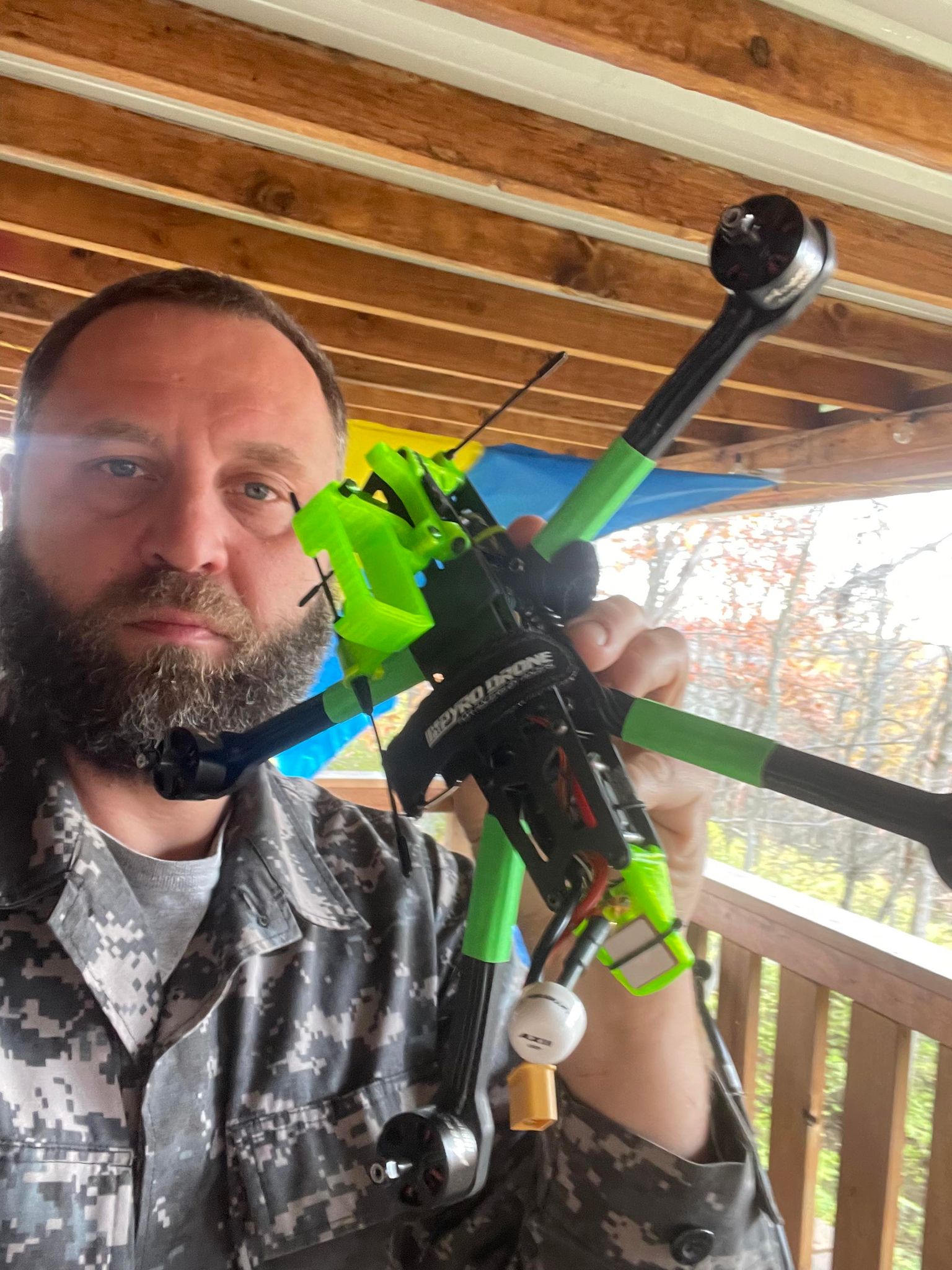 A supporter showing a drone used in the foundation’s aid efforts